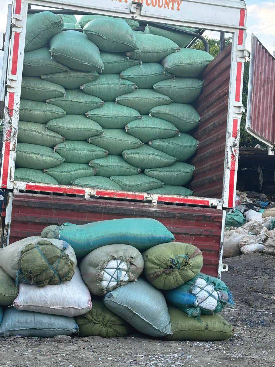Truck loaded with sacks of collected material